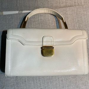 Never used. Vintage. White/gold purse